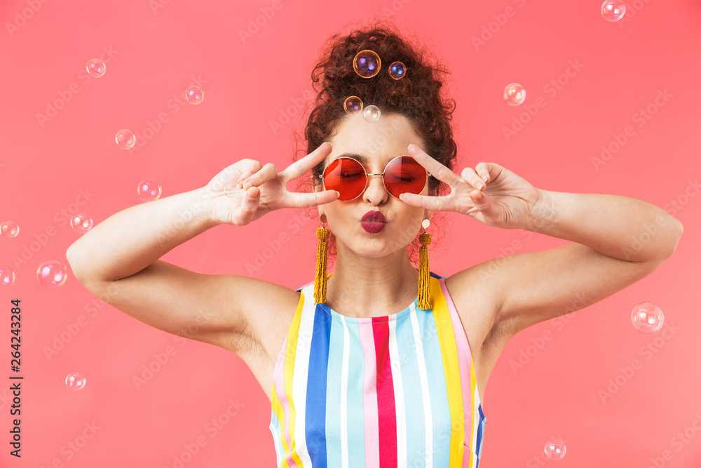 Playful pretty redhead woman wearing in dress and sunglasses - obrazy, fototapety, plakaty 