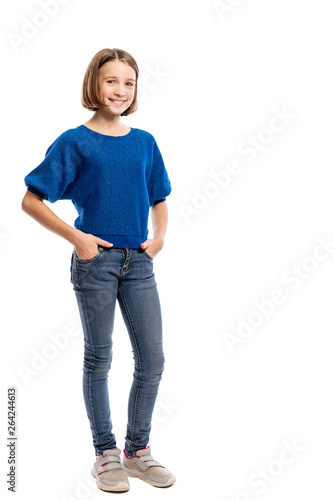 Laughing cool teen girl, full length. Isolated on white background, vertical. Copy space.