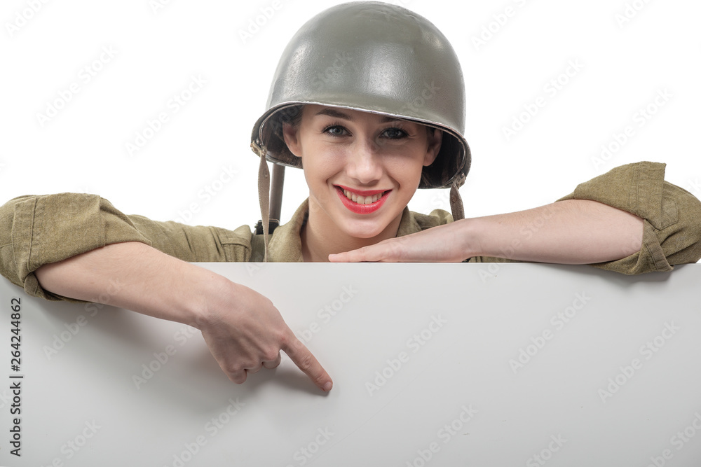 young woman dressed in American ww2 military uniform showing empty blank signboard young woman dressed in American ww2 military uniform showing empty blank signboard