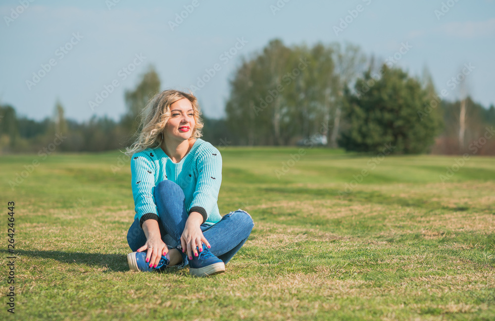 Freedom concept. Woman rest at nature field at sunset Freedom concept. Woman rest at nature field at sunset