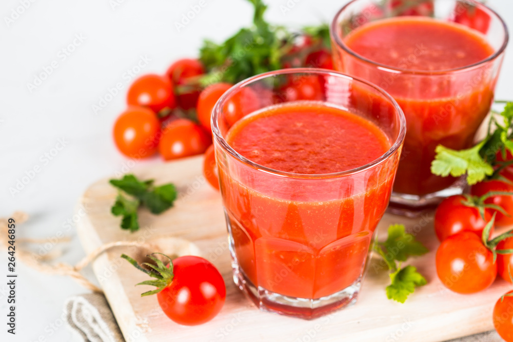 custom made wallpaper toronto digitalTomato vegetable juice in glass on white.