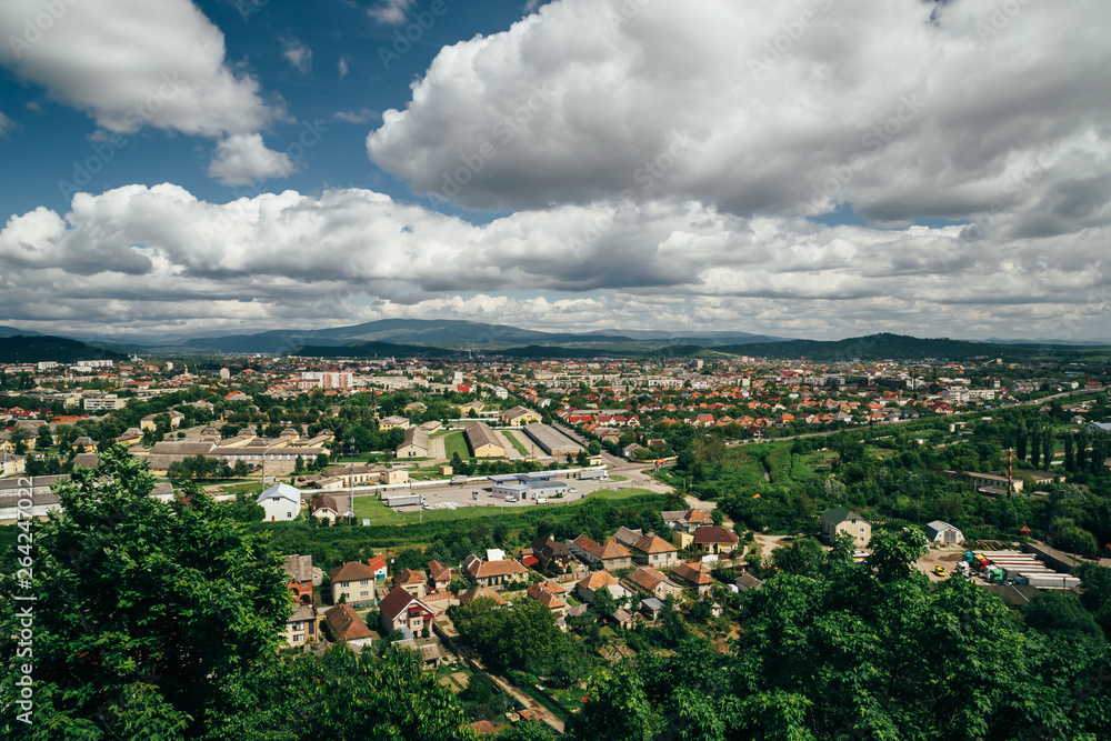 Obraz premium Beautiful panoramic view of Mukachevo, Ukraine from the top of The Palanok Castle or Mukachevo Castle at bright sunny day