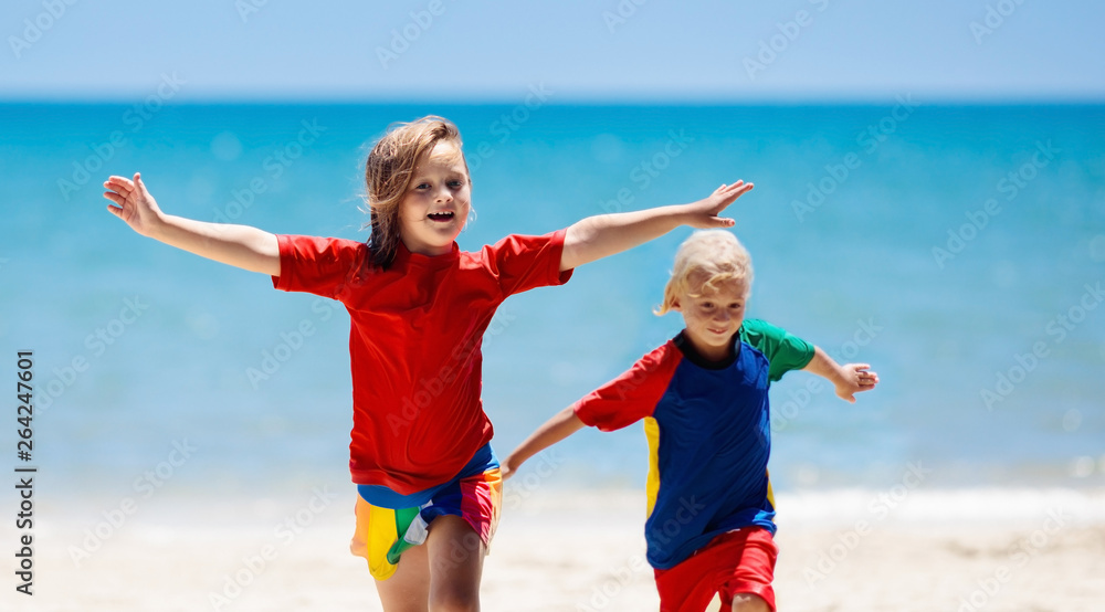 Kids playing on beach. Children play at sea. Kids playing on beach. Children play at sea.