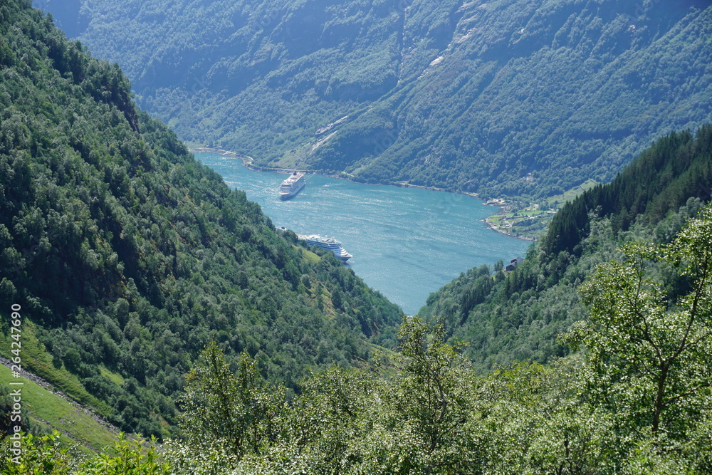 Geiranger fjord with blue sky and with cruise liners in Norway