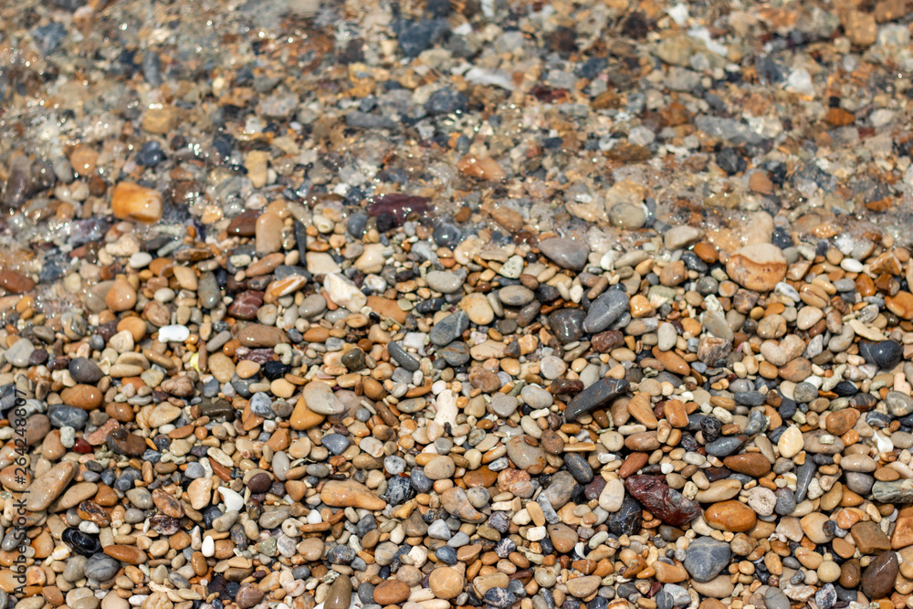 Stone gravel, beach area stone gravel several colors and coral fragments at have shape rounded round caused because of sea waves make give objects bump together all the time cause beauty naturally. Stone gravel, beach area stone gravel several colors and coral fragments at have shape rounded round caused because of sea waves make give objects bump together all the time cause beauty naturally.