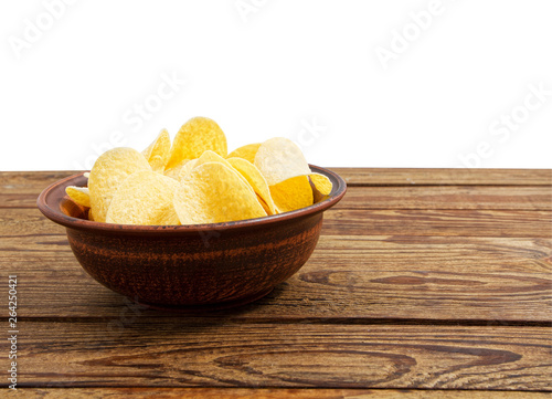 potato chips on empty wooden table isolated on white background copy space