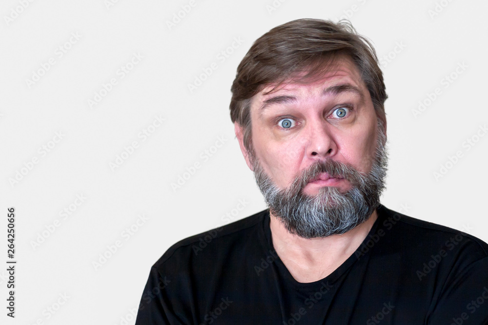 A surprised middle aged man with a beard. A surprised middle aged man with a beard.