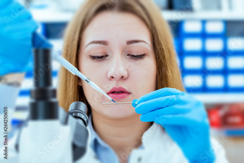 Girl lab technician at the clinic s microbiology laboratory