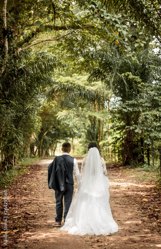 bride and groom in teh park forest bride and groom in teh park forest