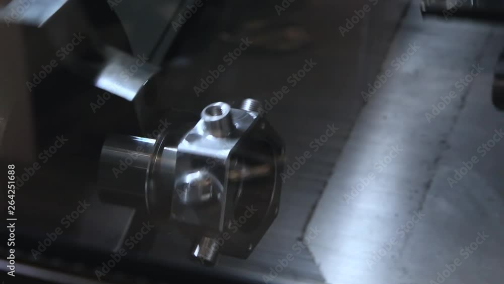 Metalworking CNC milling machine at work. Modern tool in heavy industry. High precision manufacture of steel parts. Automation of process indoors. Modern processing technology close up Metalworking CNC milling machine at work. Modern tool in heavy industry. High precision manufacture of steel parts. Automation of process indoors. Modern processing technology close up