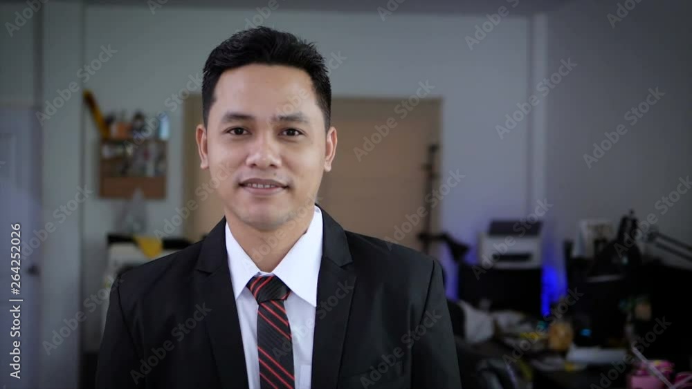 Asian businessman is smiling with happiness Asian businessman is smiling with happiness