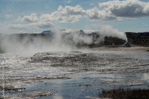 Seltun / Krysuvik (Krýsuvík): Fumarole emit sulphur gas behind geothermal field with puddles of hot water photo