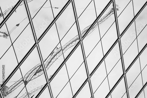 crain reflection on modern office window - monochrome