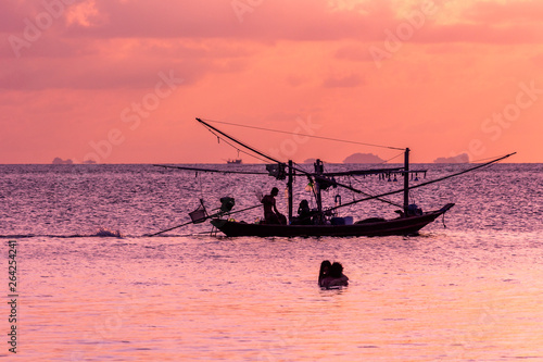 Fishing boat silouhette at sunset