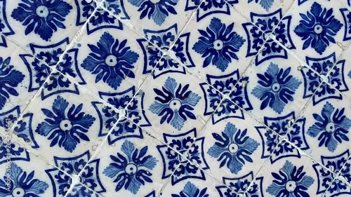 Abstract rotating background of painted ceramic tiles in blue and white