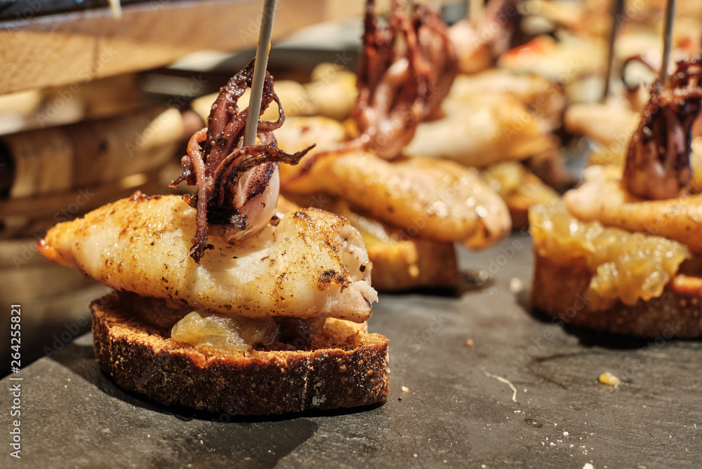 Naklejka premium Pintxos, tapas in San Sebastián, Basque Country, Spain