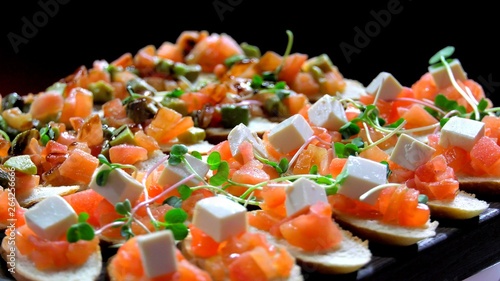 Mini canape with cheese meat and seafood close-up shot.