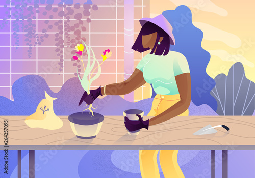 Young Woman in Gloves and Hat Replanting Flower.