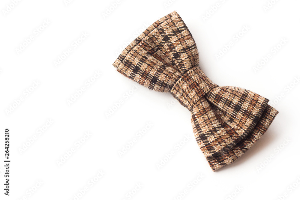 Brown checkered bow tie on a white background. Men's and women's accessories. Hipster style Brown checkered bow tie on a white background. Men's and women's accessories. Hipster style