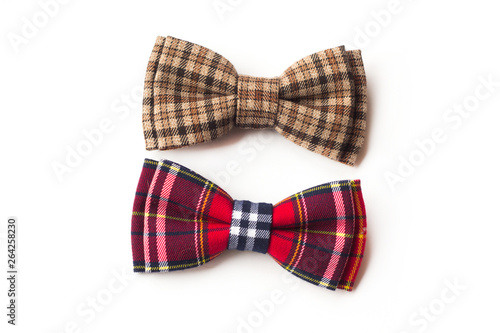 Brown checkered bow tie on a white background. Men's and women's accessories. Hipster style