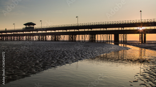 Sunrise through the pier from the beach at Ryde  Isle of Wight