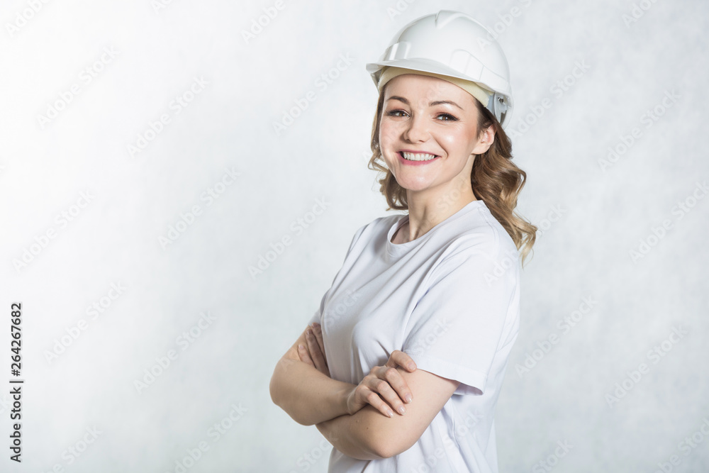 Young architect woman in white safety helmet hardhat on white background. Young architect woman in white safety helmet hardhat on white background.