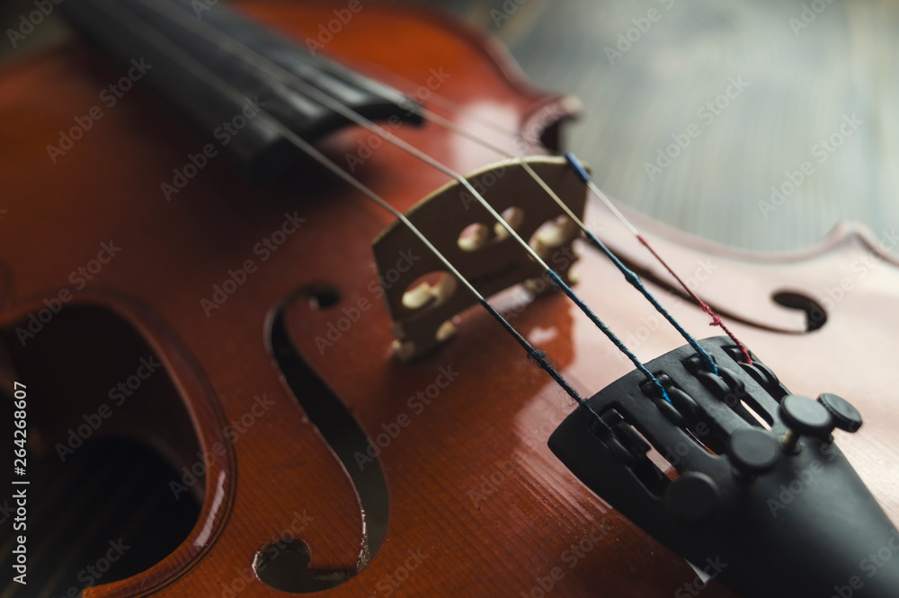Violin lying on wooden background. Violin lying on wooden background.