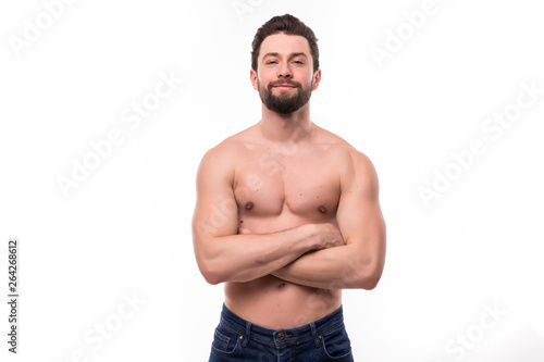 Portrait of a well built shirtless muscular man against on white background