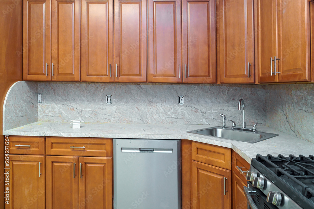 Installing cabinets in a kitchen of dark color Installing cabinets in a kitchen of dark color