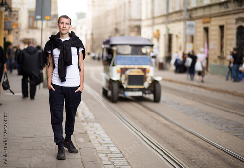 Young traveler man walk alone by old europen street © Svetlana