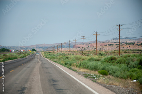 Tableau sur toile Straight road with telegraph poles in USA
