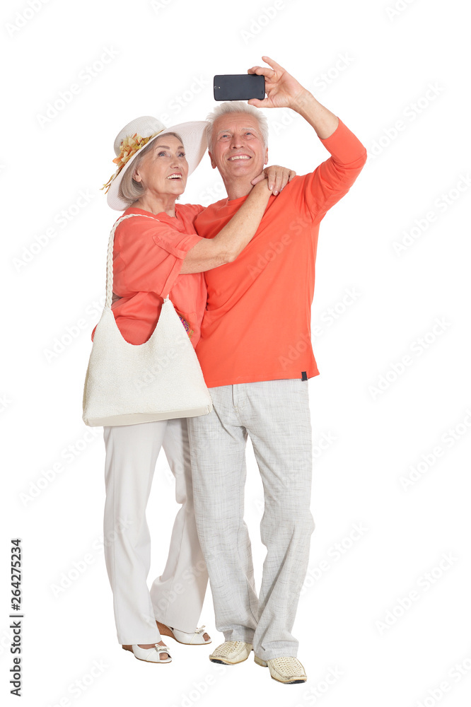Portrait of happy senior couple taking selfie photo at white background Portrait of happy senior couple taking selfie photo at white background