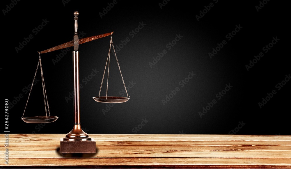Law scales on table background. Symbol of justice Law scales on table background. Symbol of justice