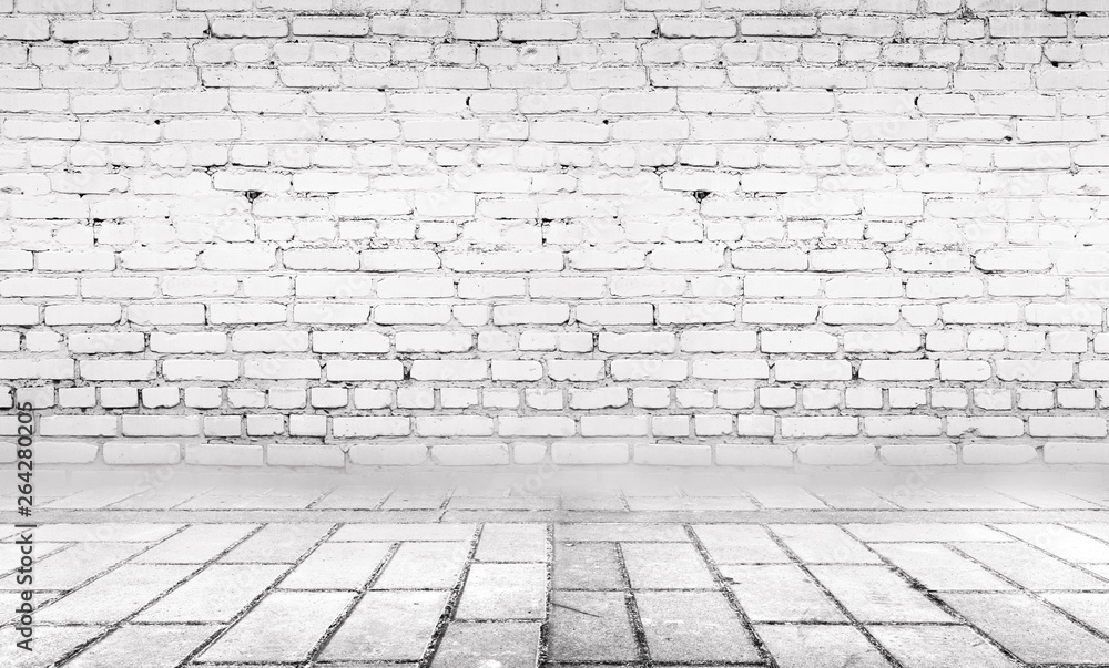 Background of empty gray room with brick wall and concrete floor.