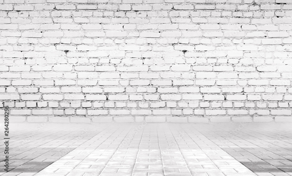 Background of empty gray room with brick wall and concrete floor. Background of empty gray room with brick wall and concrete floor.
