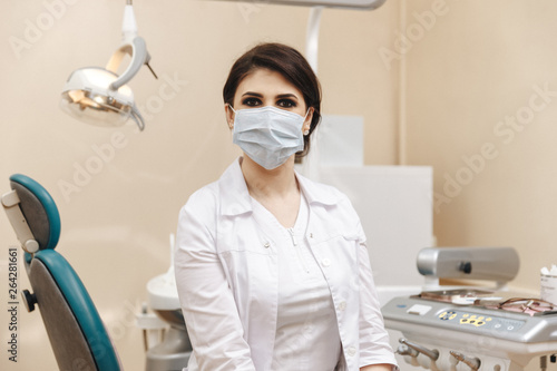 Closeup photo of female doctor in the dentist cabinet