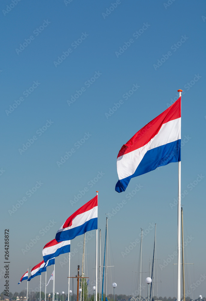Flags of The Kingdom of the Netherlands, Dutch national flag in three colors red, white and blue and blue sky