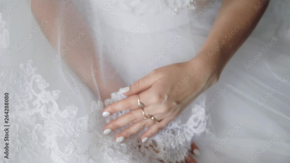 beautiful young hands of a bride with a manicure on a light background beautiful young hands of a bride with a manicure on a light background