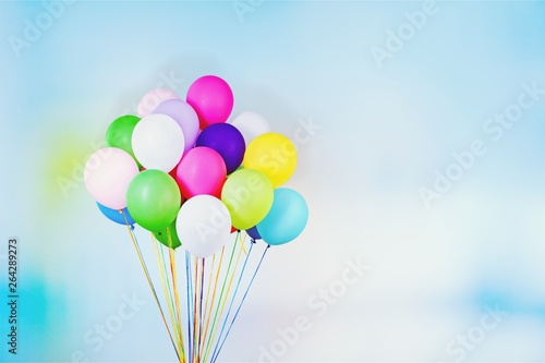 Bunch of colorful balloons on light background