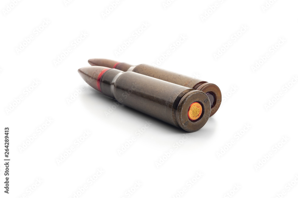 Two old bullets for automatic rifles of 5.45 and 7.62 caliber. Selective focus. Two old bullets for automatic rifles of 5.45 and 7.62 caliber. Selective focus.