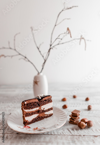  Delicious chocolate cake on plate on table on light wooden background 