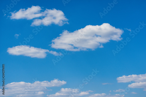 White, Fluffy Clouds In Blue Sky. Background From Clouds. Clear blue sky with white clouds background.