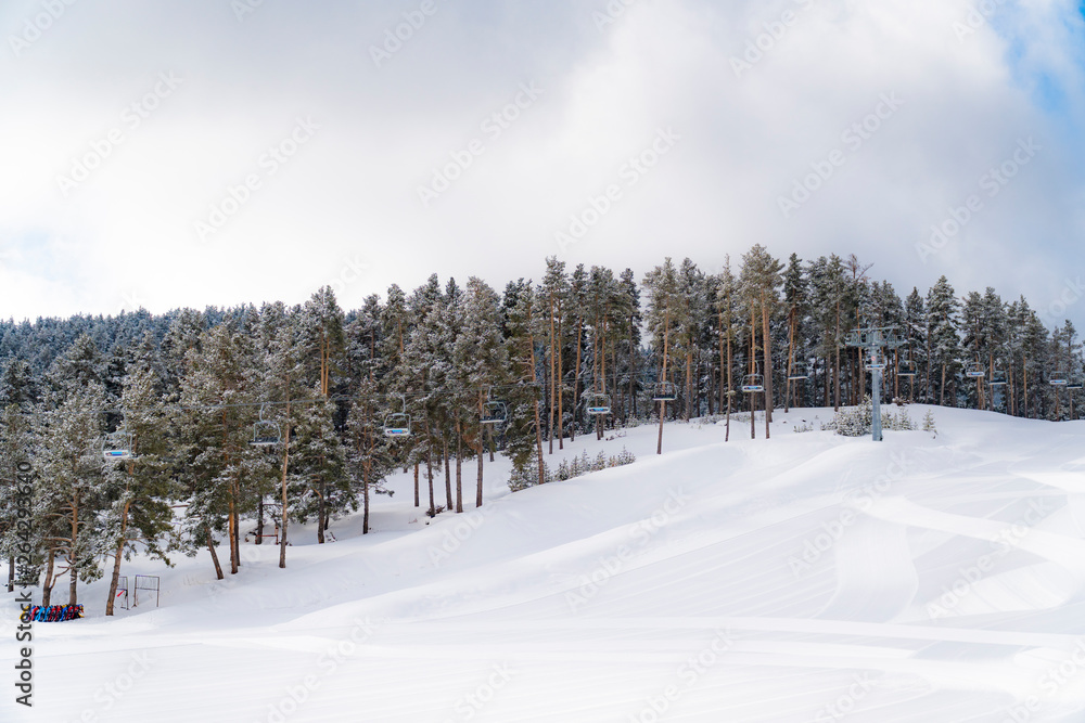 Riding the Chair Lift through the Forest of the High Mountains with Snow Covered Trees. Sarıkamış / TURKIYE / TURKEY Riding the Chair Lift through the Forest of the High Mountains with Snow Covered Trees. Sarıkamış / TURKIYE / TURKEY