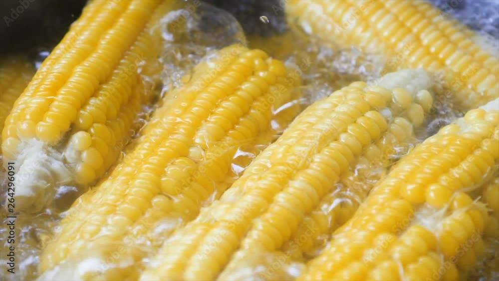 Close up shot corn boiling in the hot pot high vitamin fruit and vegetable Close up shot corn boiling in the hot pot high vitamin fruit and vegetable