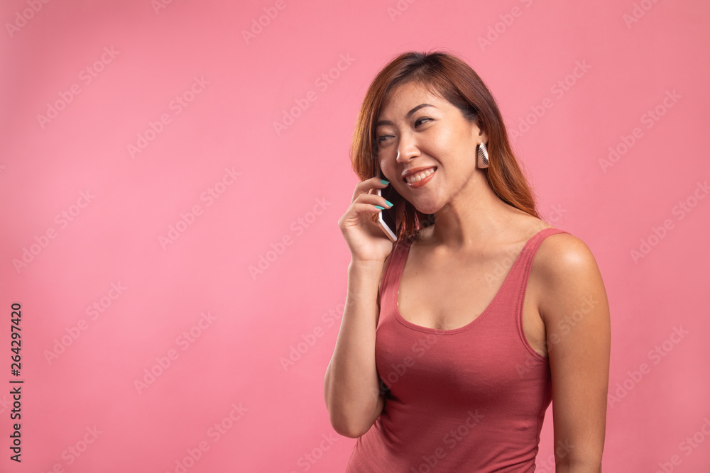 Young Asian woman talking with mobile phone. - obrazy, fototapety, plakaty 