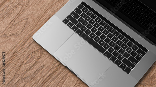 Laptop, dark aluminium body. Laptop in focus. Template, mockup.