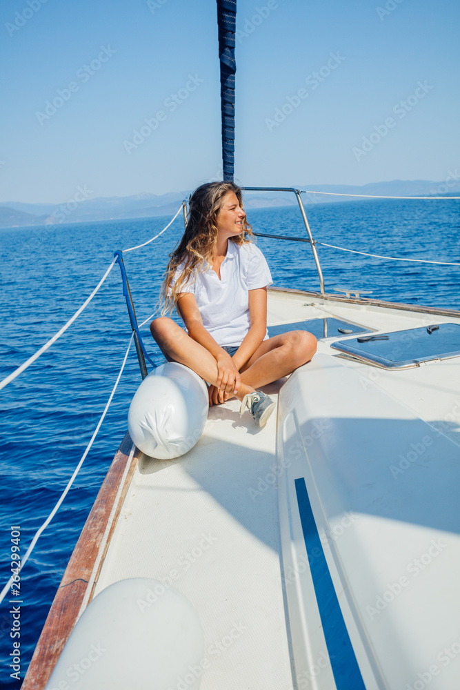 Beautiful Girl relaxing On Yacht in Greece