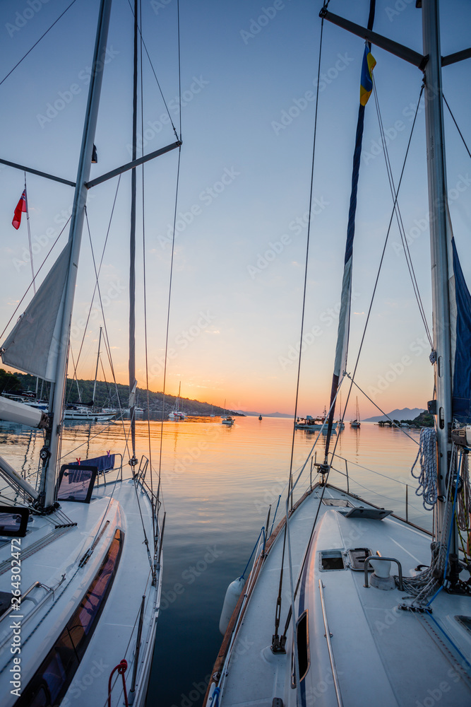 Sailing boat in the sea during awesome sunset. Sailing boat in the sea during awesome sunset.