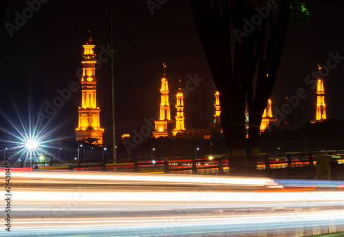 Samarinda Islamic center at nigh, with light trails of traffic