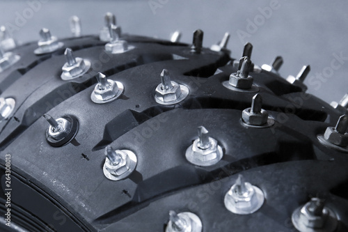 huge spikes on a motorcycle wheel close up. winter motorcycle sport tire